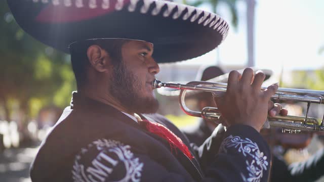 Traditional mariachi trumpeter playing outdoors