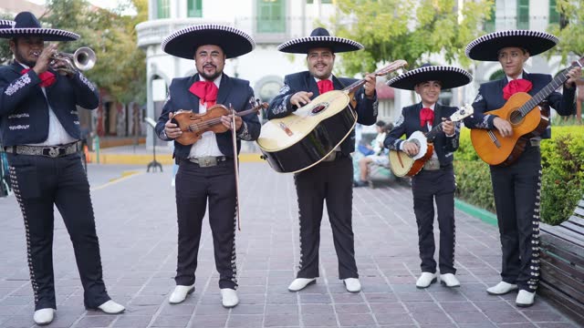 Group of traditional mariachis playing outdoors