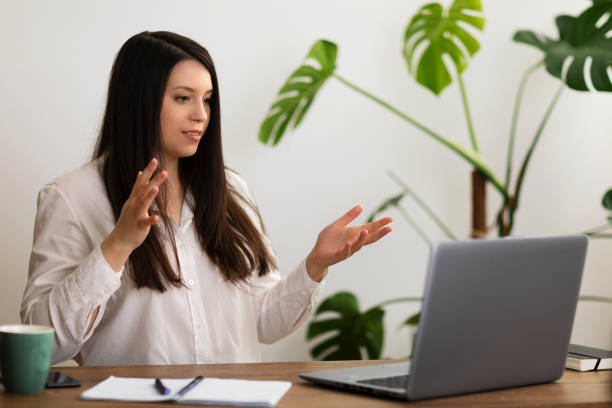 istock Young woman having a video conference in home office 1478178775