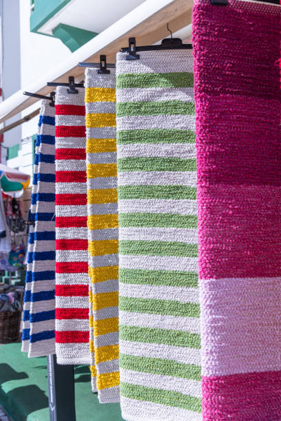 Europe, Portugal, Aveiro, Costa Nova do Prado. Brightly colored beach towels at the Costa Nova do Prado.