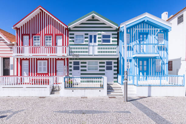 istock Brightly painted beach homes at the Costa Nova do Prado. 1478185433