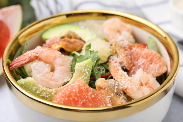istock Delicious pomelo salad with shrimps on table, closeup view 1478193168