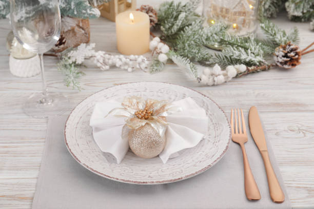 istock Festive place setting with beautiful dishware, cutlery and decor for Christmas dinner on white wooden table 1478198784