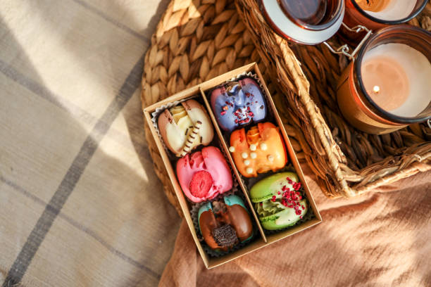 Box of macaroons with different assortment top view in a homely atmosphere
