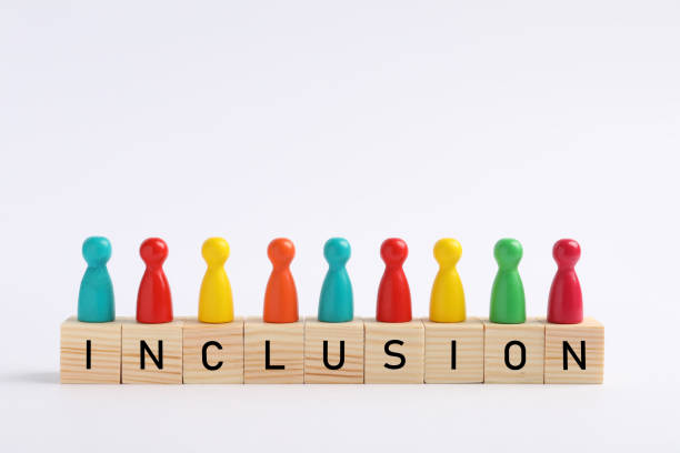istock Colorful pawns and cubes with word Inclusion on white background 1478199586