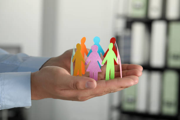 istock Man holding paper human figures in office, closeup. Diversity and Inclusion concept 1478200425