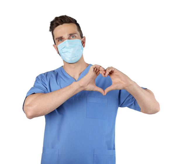 istock Doctor in protective mask making heart with hands on white background 1478201113