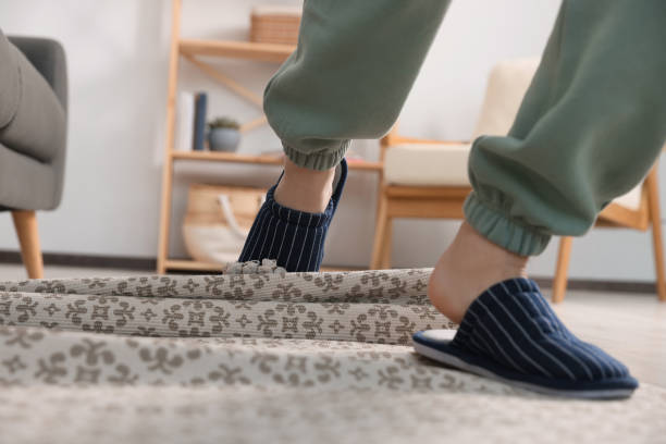 istock Man tripping over rug at home, closeup 1478201159