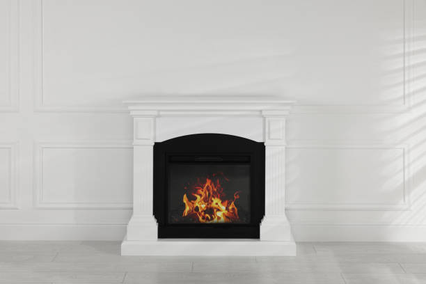 istock Modern electric fireplace near white wall in room 1478201793