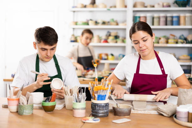 istock Young woman and young man making pottery 1478207116