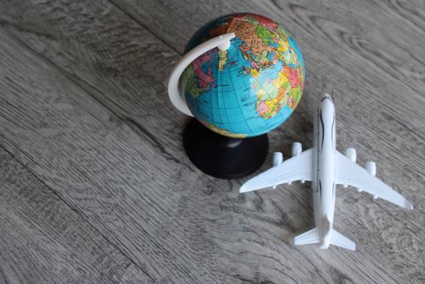 istock Top view image of world globe and toy plane with copy space. 1478207534