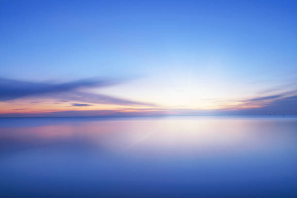 istock Calm blue colored sea and clear sky at sunset 1478211076