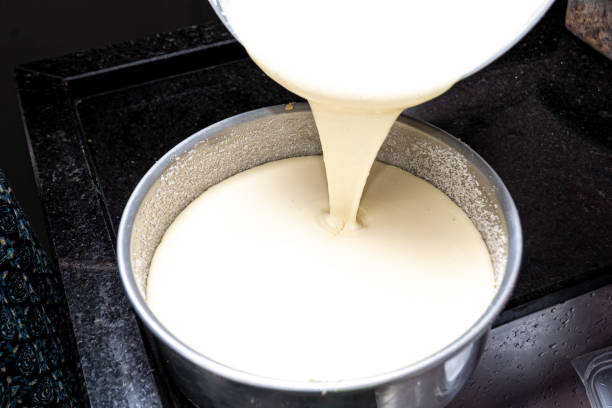istock Creamy ingredient being mixed to make cheesecake. Plastic utensil. 1478213854