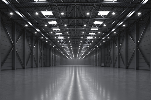 Interior view of an empty large modern warehouse.
