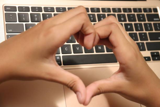 istock Hands showing Love Heart on a Laptop 1478223682