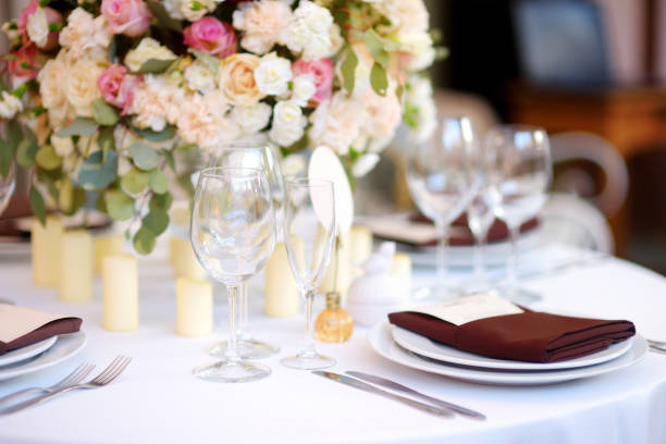 istock Beautiful table setting with crockery and flowers for a party, wedding reception or other festive event 1478225328