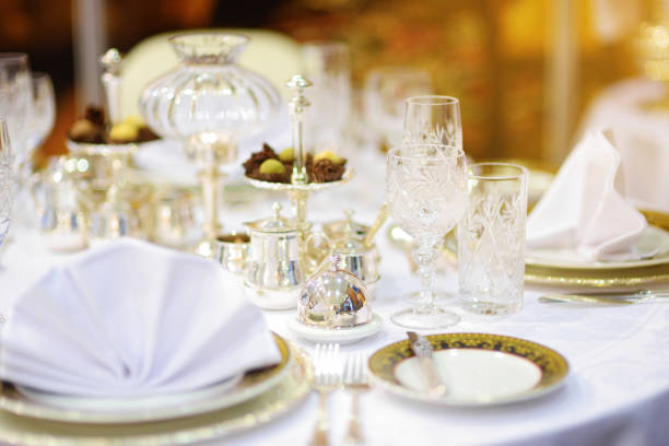 istock Beautiful table setting with crockery and flowers for a party, wedding reception or other festive event 1478225356