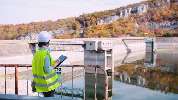 istock Female engineer works at hydroelectric power plant. Renewable energy systems. 1478226094
