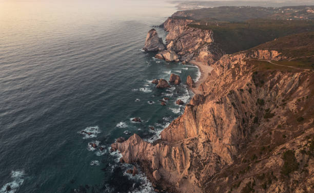 istock Rough cliffs near waving sea 1478227669
