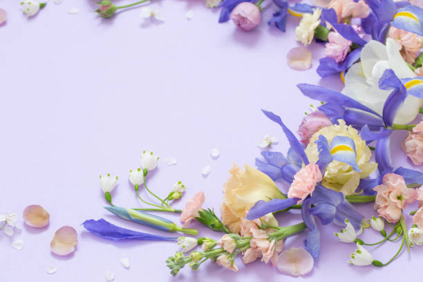 istock beautiful spring flowers on paper background 1478227698