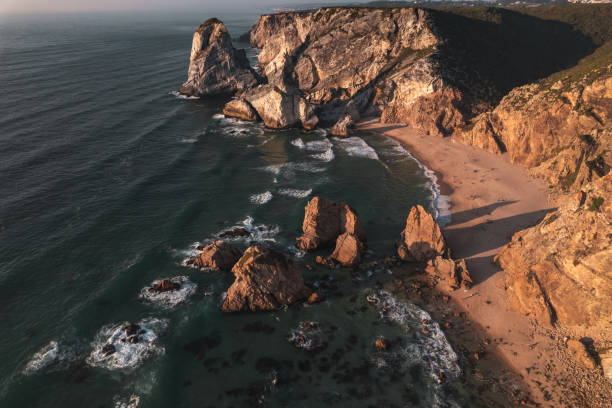 istock Sea waving near rocks and beach 1478227709