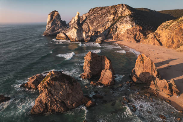 istock Rock formations in waving sea 1478227740