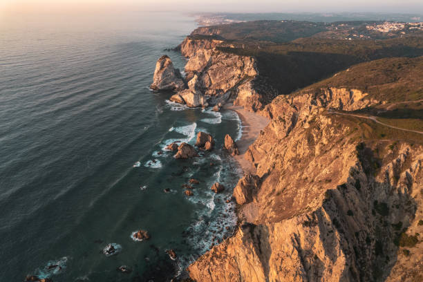 istock Cliffs above waving sea at sundown 1478227852