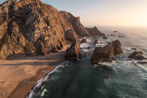 istock Beach and cliffs near sea at sunset 1478227905
