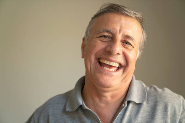 istock Portrait of senior man laughing 1478228105