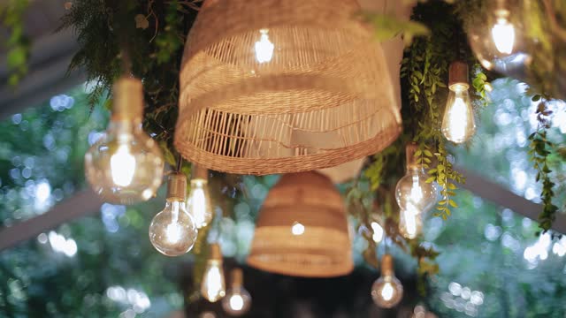 Cool and very beautiful light bulbs and decor above the table at the event. smooth camera movement through the decor