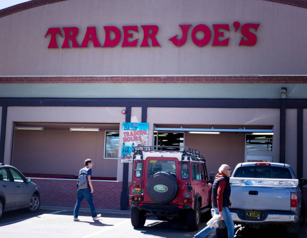Santa Fe, NM: Two men and vehicles outside Trader Joe’s in Santa Fe, NM.