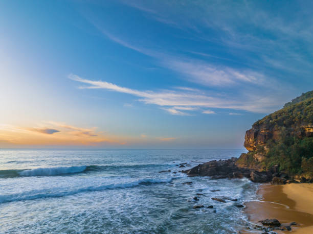 istock Sunrise at the seaside with pretty clouds 1478236785