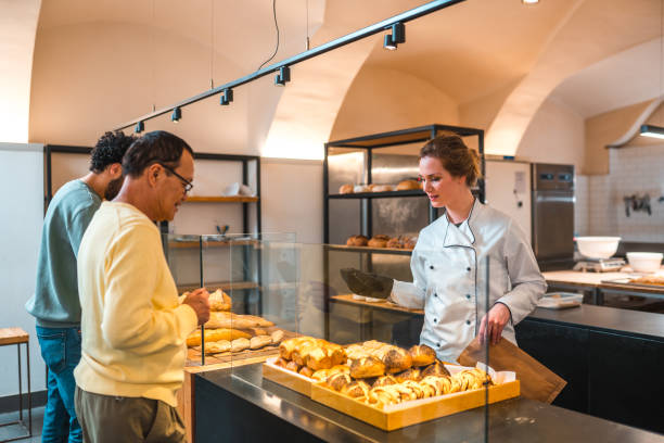 istock Diverse Customers Buying Baked Goods In Small Artisan Bakery 1478239630