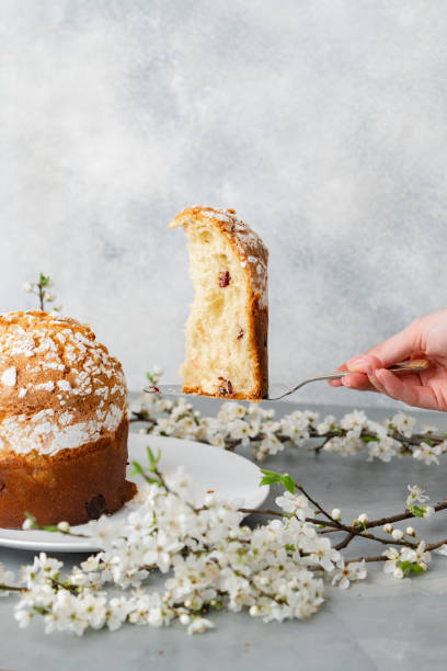istock Hand holding piece of Easter cake on dessert spatula 1478243363
