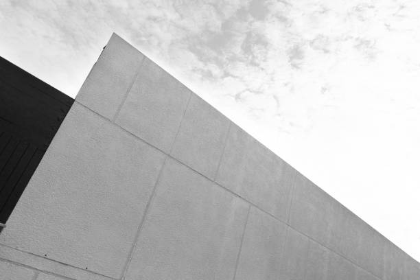 istock black and white concrete part of building with cloud sky architecture background 1478245377