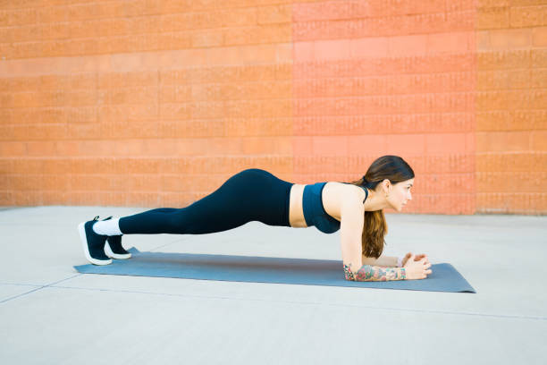 istock Strong attractive woman doing plank exercises 1478246953