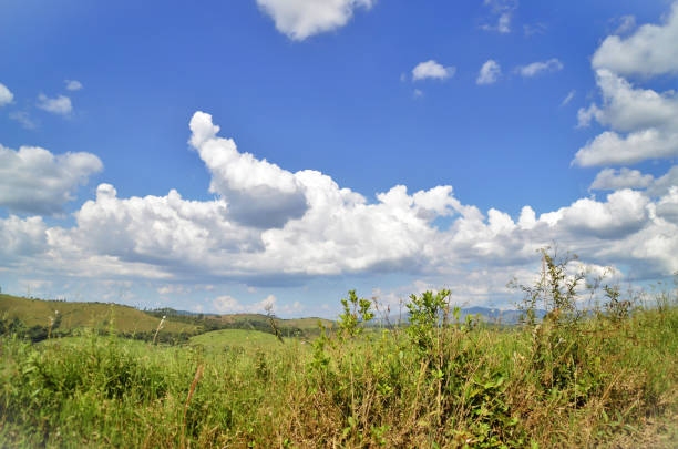 The beautiful nature and the clouds in the green mountains on the way to the city of Arantina in Minas Gerais