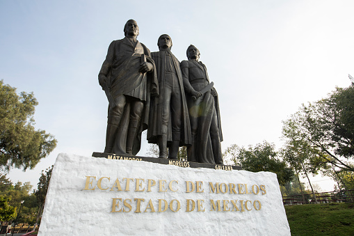 Ecatepec de Morelos, Mexico - November 19, 2022: Morning light shines on Statues of Mariano Matamoros, José María Morelos and Hermenegildo Galeana in Ecatepec's main square.