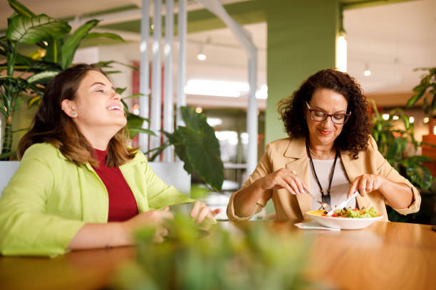 istock Women having lunch break together at work 1478252194
