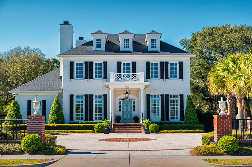 Large traditional house in Myrtle Beach, South Carolina, USA on a sunny day.