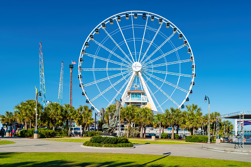 The landmark SkyWheel in downtown Myrtle Beach, South Carolina, USA on a sunny day.