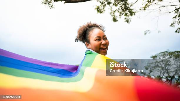 African Girls And The Power Of Lgbtq Support Woman And Rainbow Flag The Power Of Lgbtq Support Stock Photo - Download Image Now