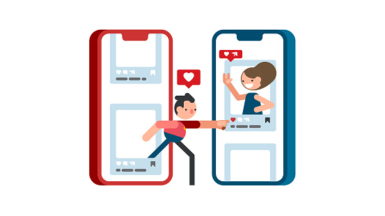 istock Young man presses heart button on mobile phone for beautiful girl 1478270373