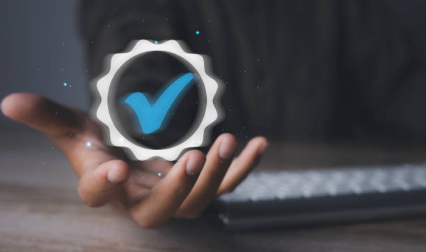 istock Man holding quality assurance icon or QA and Quality Control or QC. 1478271481