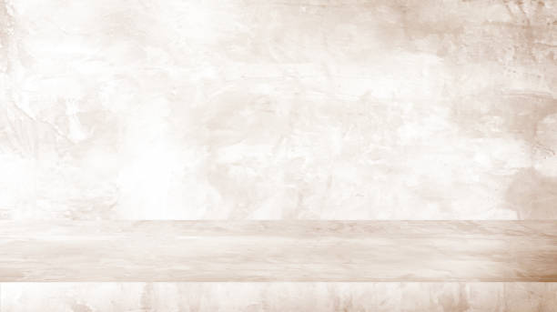 istock background and concrete backdrop and cement shelf showing products in white and orange , empty studio interior and with empty messages background. 1478271684