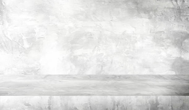 istock background and concrete backdrop and cement shelf showing products in whtie and gray , empty studio interior and with empty messages background. 1478271816
