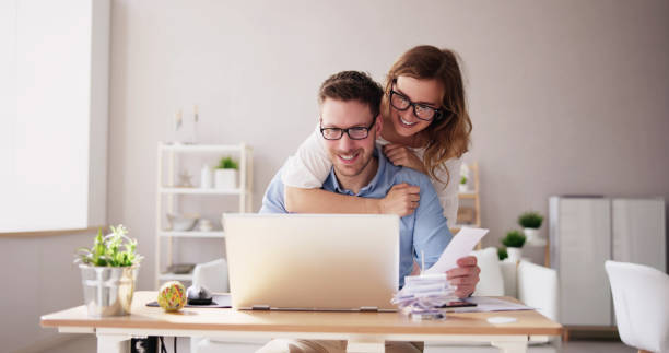 istock Happy Family Using Calculator For Tax 1478273585