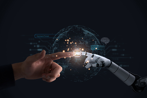 Machine learning Robotic and human hands touching a background of a massive data network link, using futuristic and cutting-edge artificial intelligence technologies.