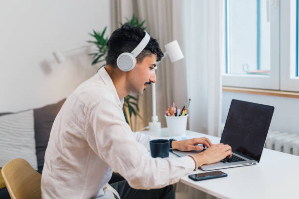 istock young adult man remote work from home 1478290524