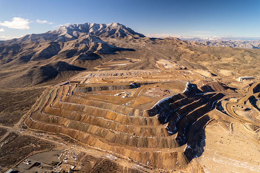 Tracktors is working on mountain of quarry in California. Quarry excavations.